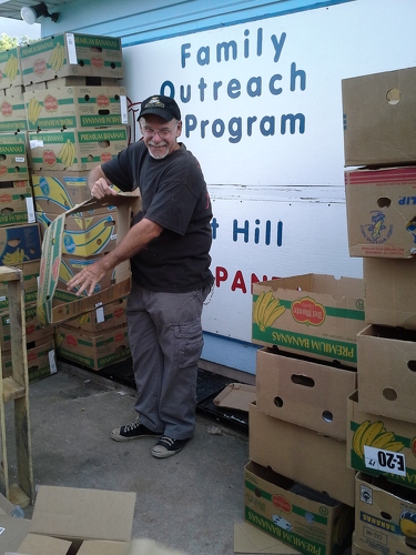 Jim breaking up cardboard on packing night 8/2013