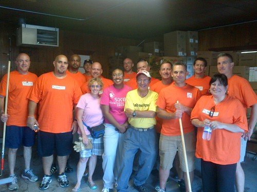 Home Depot management volunteer crew lend a huge hand pitching in where needed on our packing storage site. We have a newly painted floor too! Thanks everyone!